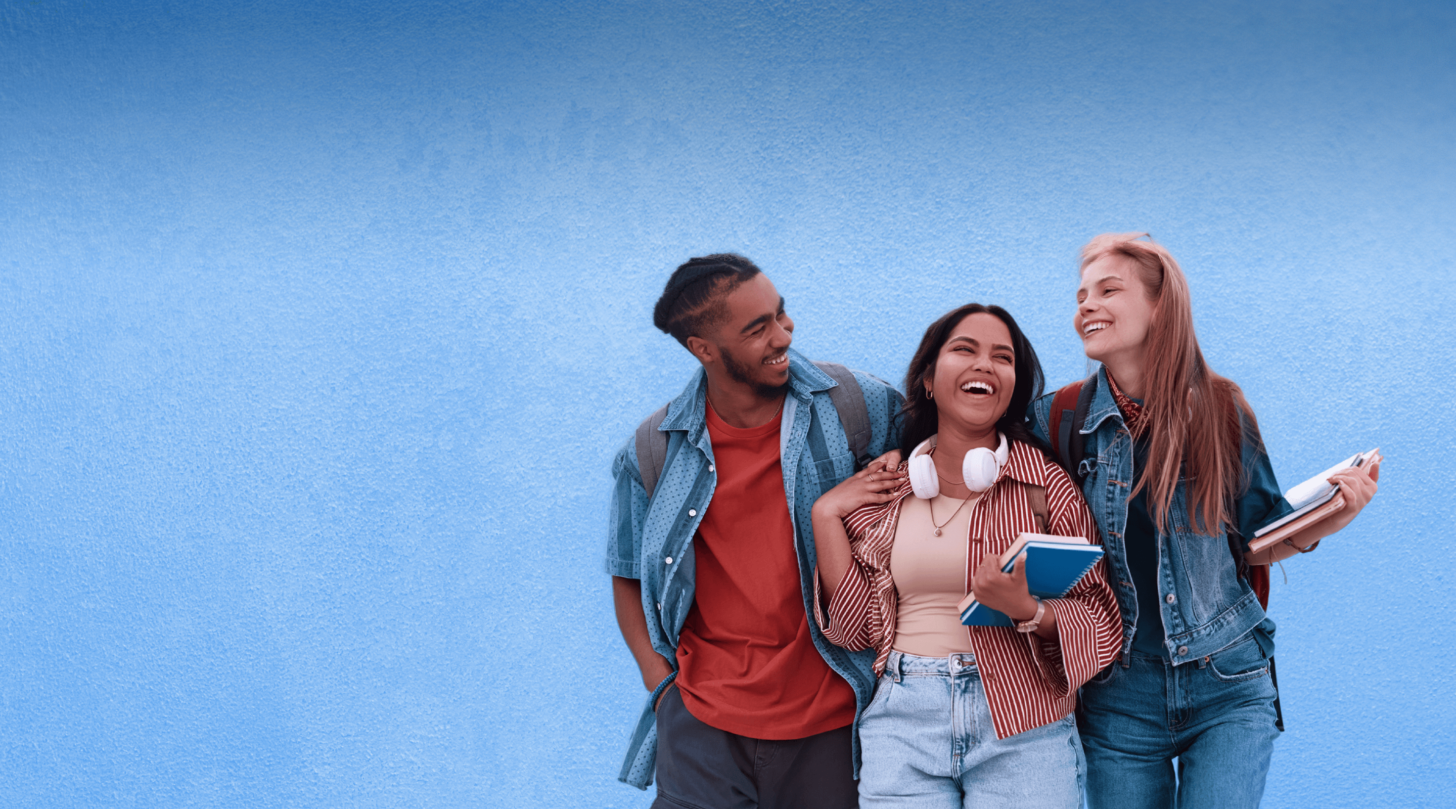 A group of college students are together talking. 