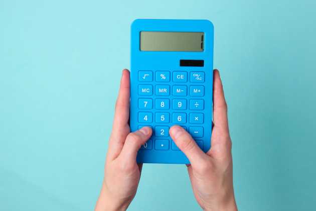hands holding a calculator
