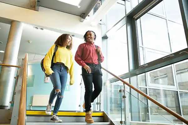 young women walking down stairs