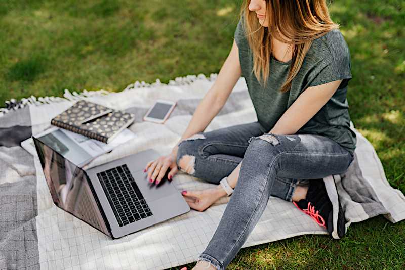 woman on laptop outside