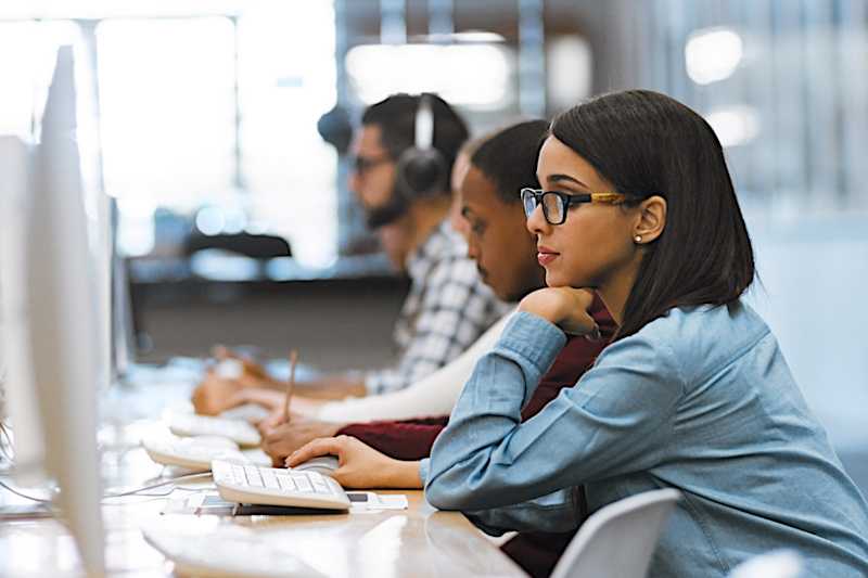 A view of college students working in a computer lab.