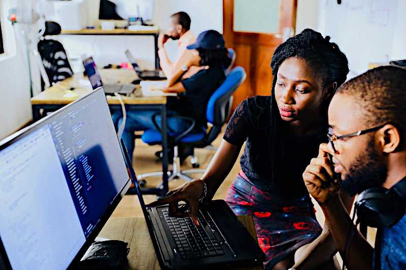 two students at computer working