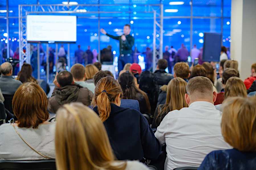 A group of people are watching a presentation.