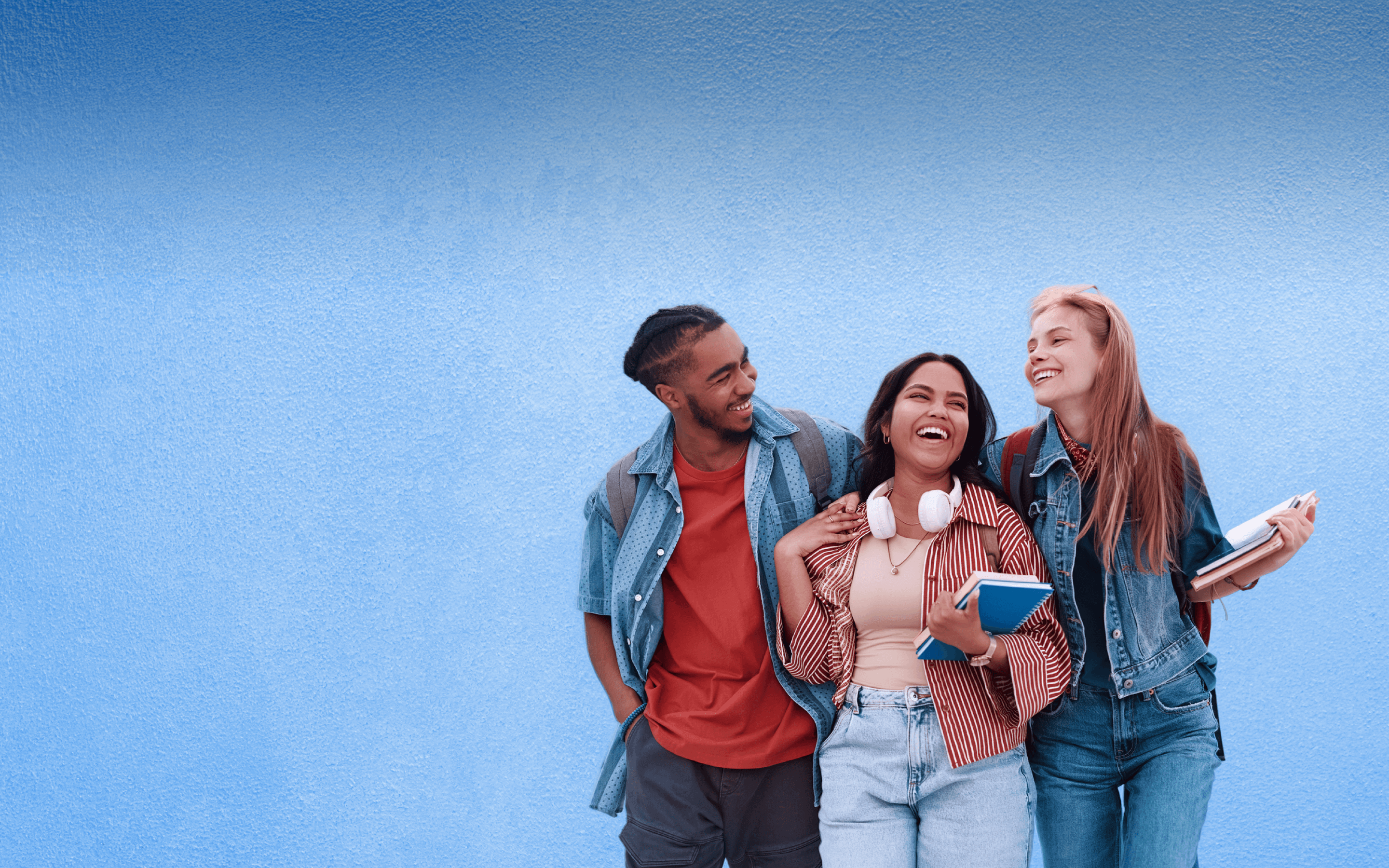 A group of college students are together talking. 