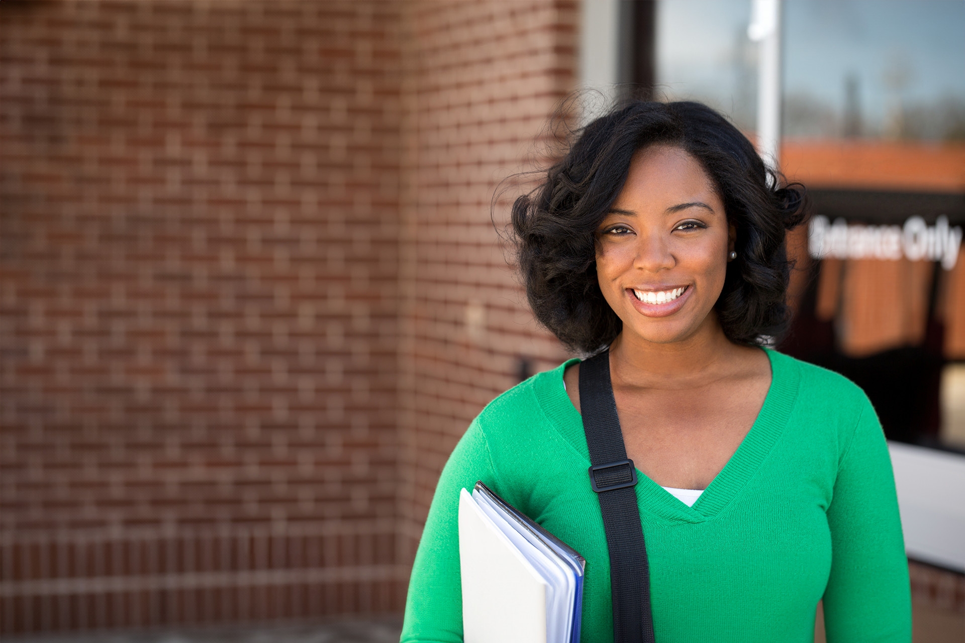 female student wilth notebook